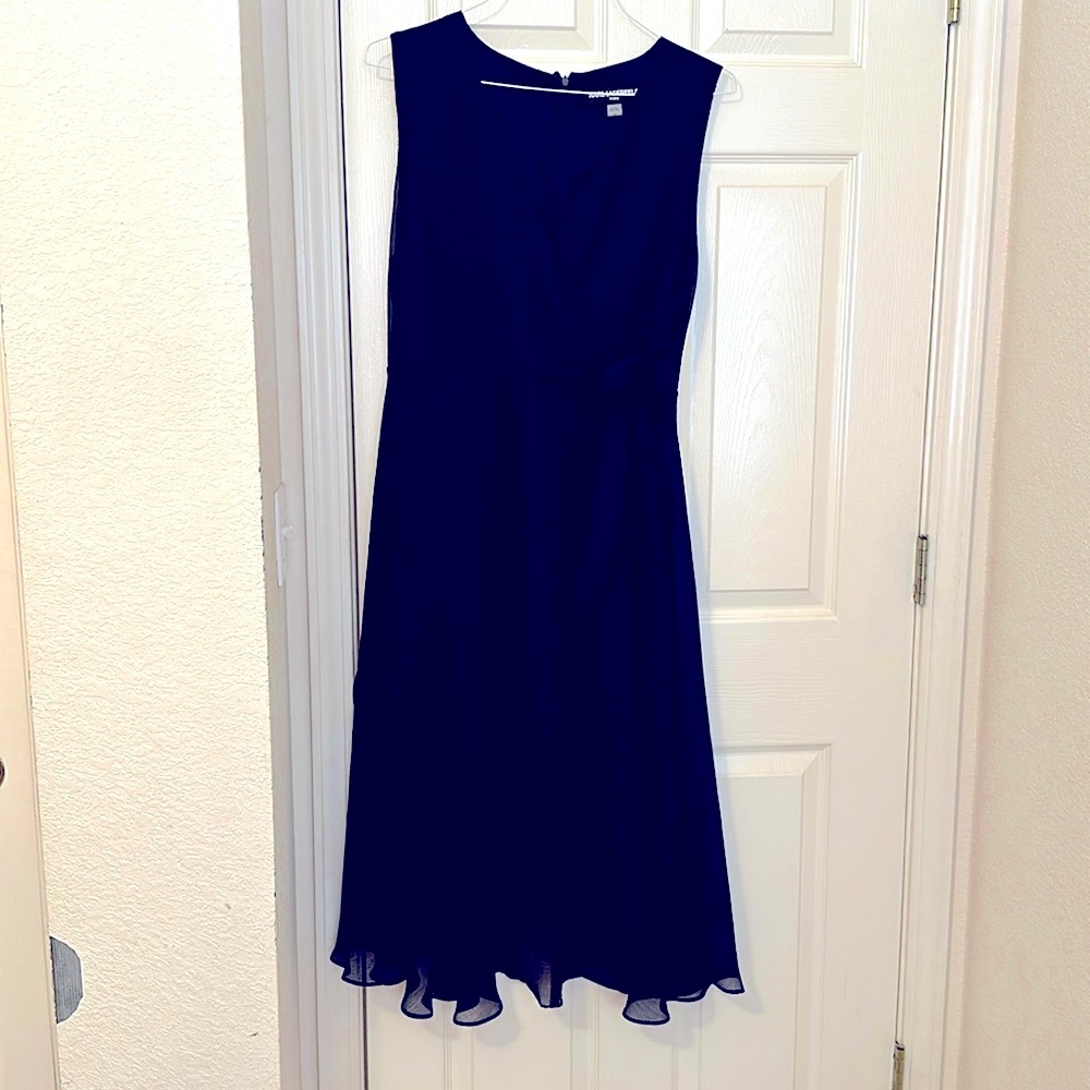 Ladies designer gown. New with tags, navy blue. Must have! Never worn